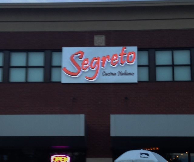 A back-lit channel letter sign for Segreto Cucina Italiano